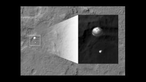 Photo by the Mars Reconnaissance Orbiter, showing the spacecraft descending to the surface via parachute.