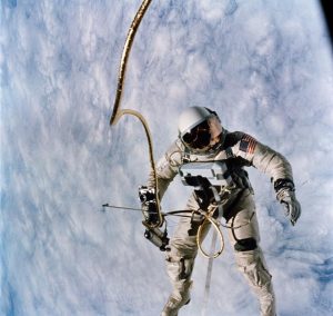 Ed White floats weightless in space during the first American spacewalk