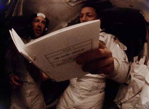 Lovell and Swigert reviewing the entry checklist