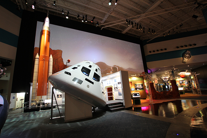 Space Center Houston’s spectacular new Mission Mars exhibit showcases an immersive experience about the red planet. Visitors can peer inside an Orion spacecraft research model, stand close to a giant model rocket and walk on a virtual Mars environment.