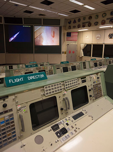 Located on the second-to-last row in Historic Mission Control, the flight director console station was home to several notable flight directors. They held the ultimate authority on ensuring the crew’s safety and the mission’s success. The flight director was one of only two consoles that could directly request an abort – a task that was never necessary during the Apollo era. Some flight directors who left their impact on the Apollo missions were Gerald Griffin, Christopher Kraft, Eugene Kranz and Glynn Lunney. Of the hundreds of buttons and controls located at this station, many have gone missing or have become faded after decades of use.