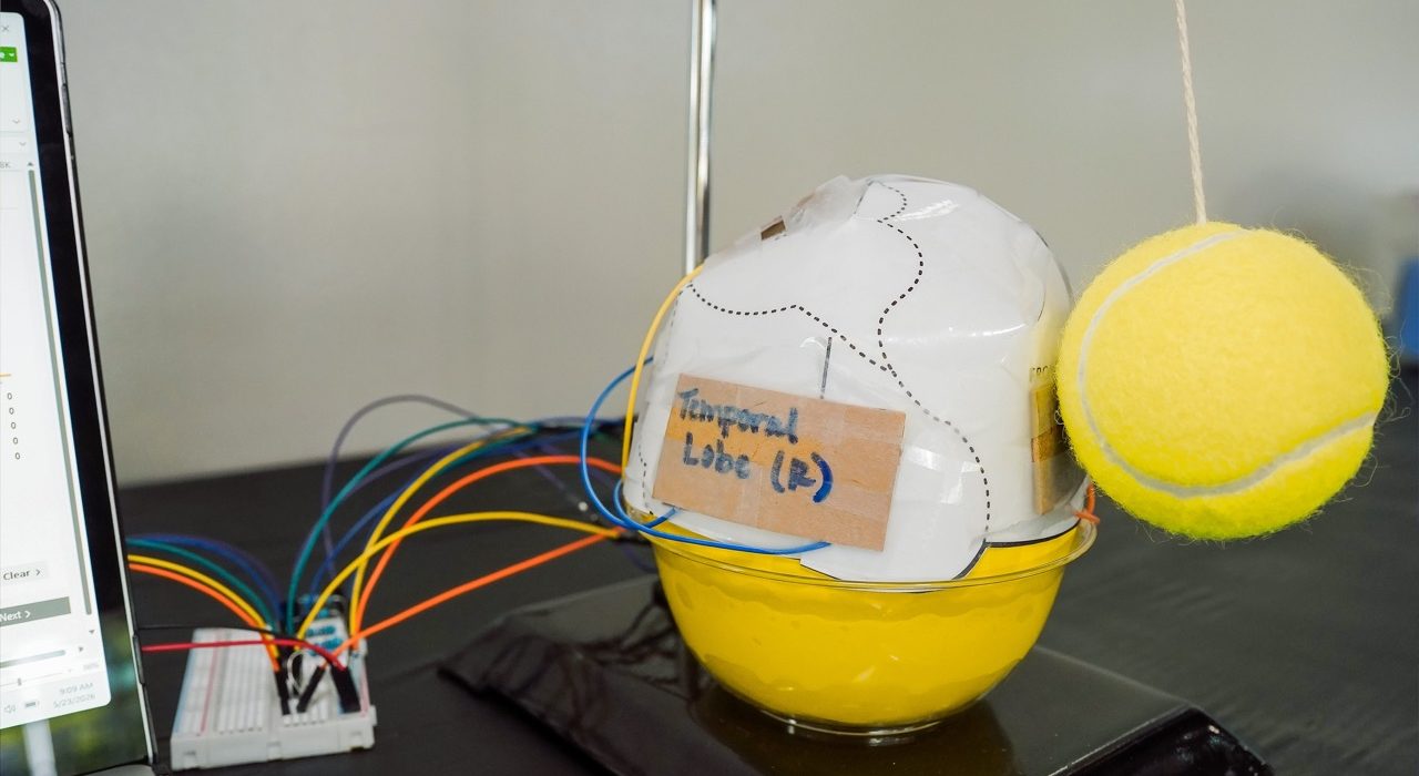 20260523, Students worked in teams to engineer a space helmet prototype designed to protect an astronaut from impact forces. Using a pre-built Brain Impact Simulator, students tested their designs, collect real-time data, and refine their solutions.† Students also explore how NFL helmet engineers and NASA engineers solve similar problems, protecting the human brain from dangerous forces. †Photos by David Duncan Photography, LLC.